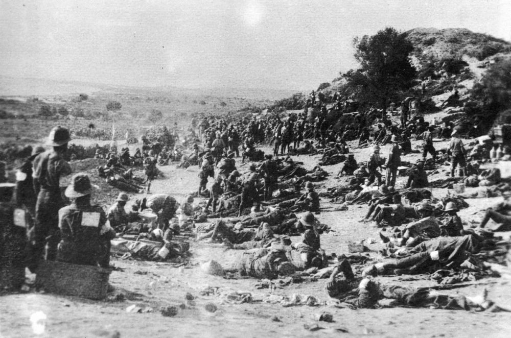 Wounded soldiers lying on a rise near Anzac Cove, photographed 7 August 1915 